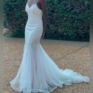 blush pink and white embellished dress with long tulle train